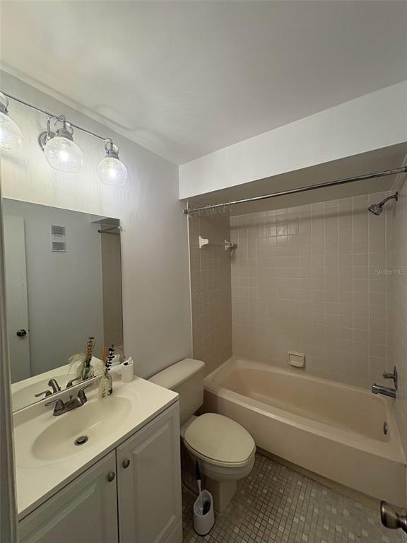 3260 Candle Ridge Drive, Unit 202 Orlando, FL 32822 - Photo 10 of 19 a bathroom with a sink toilet and shower