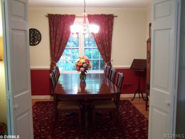 8026 Cherokee Road Richmond, VA 23225 - Photo 5 of 12 a view of a dining room with furniture and window