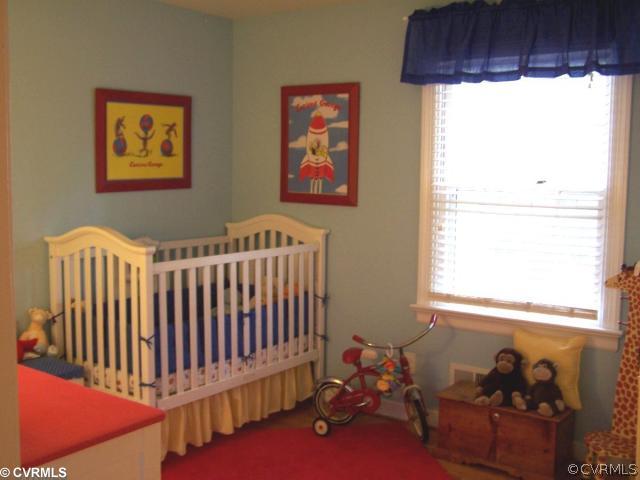 8026 Cherokee Road Richmond, VA 23225 - Photo 10 of 12 a bedroom with furniture and a window