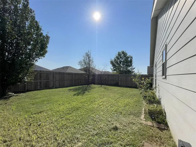 a view of backyard with green space