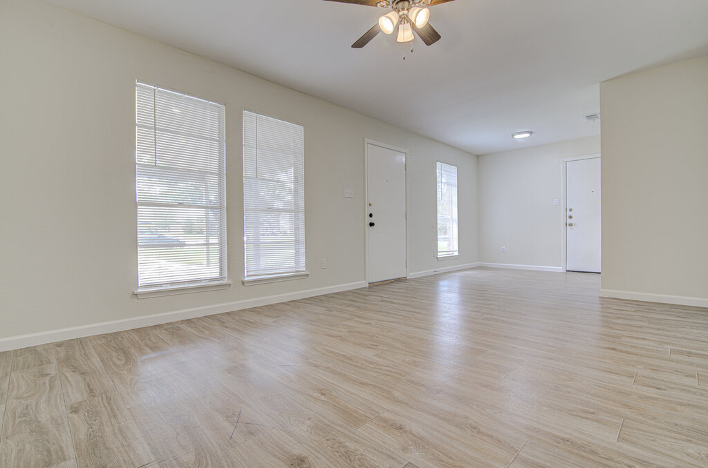 5301 Indio Circle, Unit A Austin, TX 78745 - Photo 6 of 25 An airy living room offers a tranquil setting with ample natural illumination and elegant flooring.