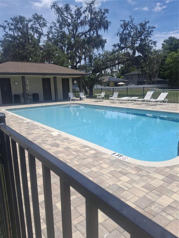 12618 Vander Way New Port Richey, FL 34654 - Photo 21 of 22 a view of swimming pool with outdoor seating