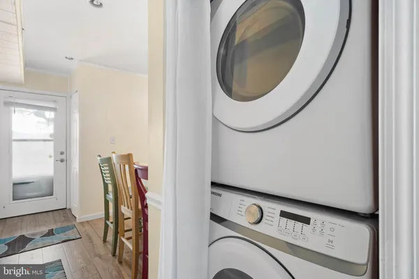 a view of storage and utility room with washer and dryer