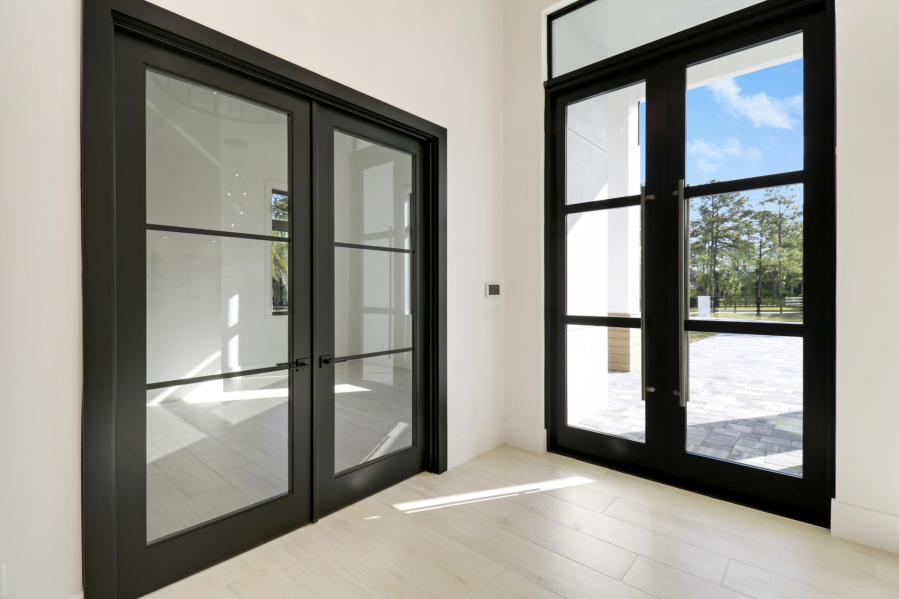 14527 Pepper Bush Drive Palm Beach Gardens, FL 33418 - Photo 14 of 81 a view of a glass door and an entryway