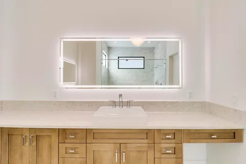 a kitchen with stainless steel appliances white cabinets and a stove