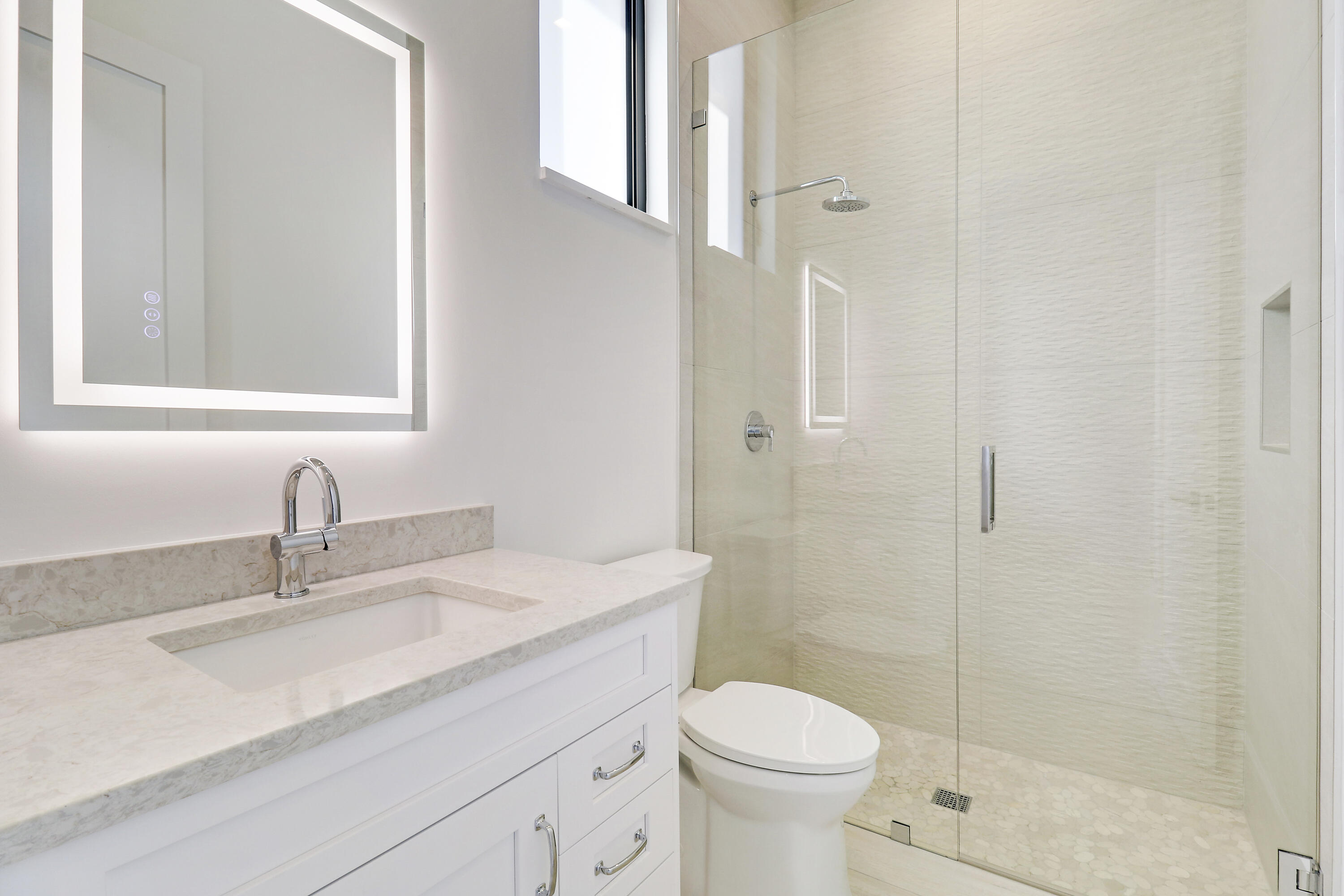 14527 Pepper Bush Drive Palm Beach Gardens, FL 33418 - Photo 39 of 81 a bathroom with a granite countertop sink a toilet and shower