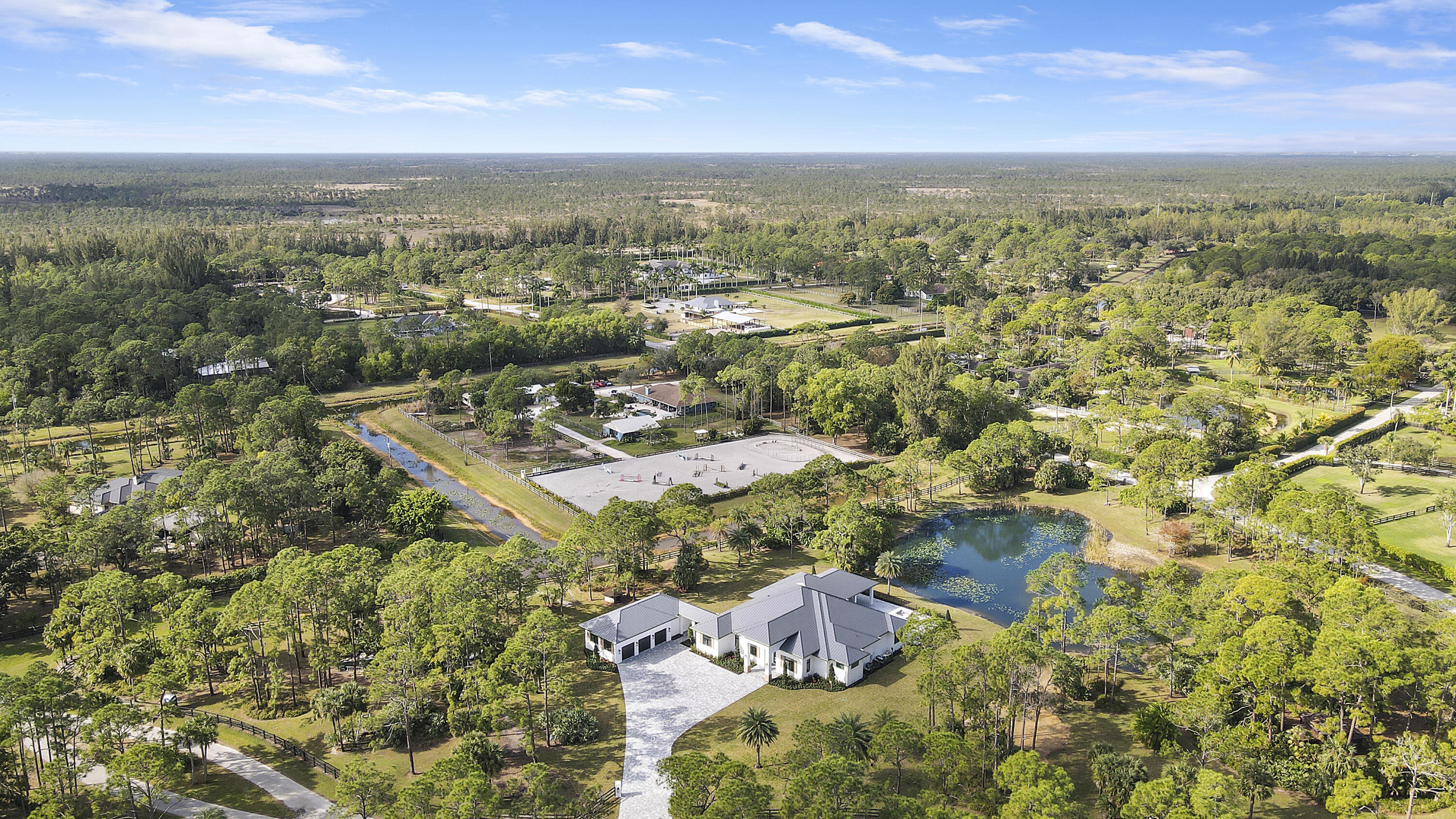14527 Pepper Bush Drive Palm Beach Gardens, FL 33418 - Photo 75 of 81 an aerial view of residential houses with outdoor space and trees