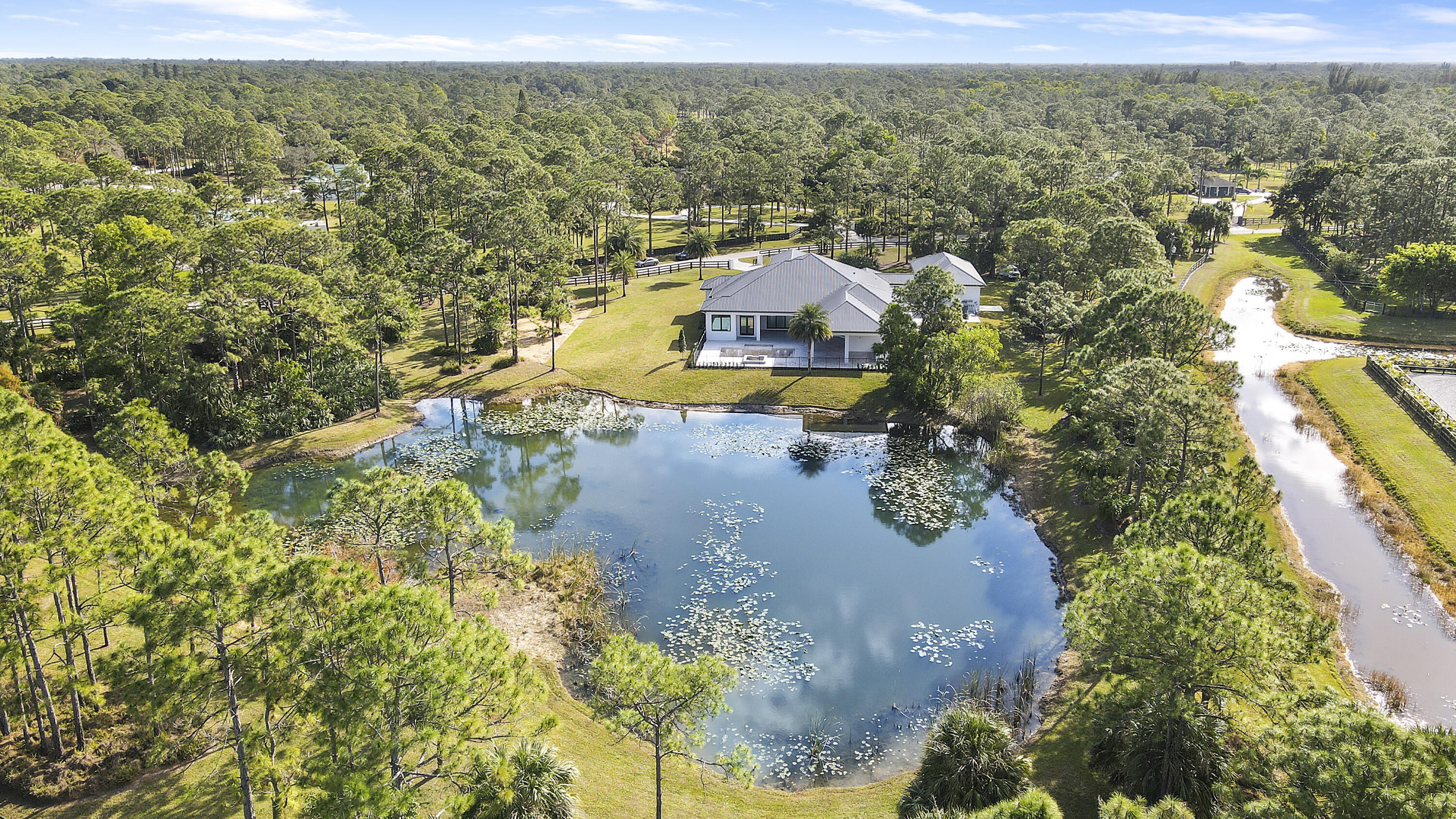 14527 Pepper Bush Drive Palm Beach Gardens, FL 33418 - Photo 81 of 81 an aerial view of a house with a yard