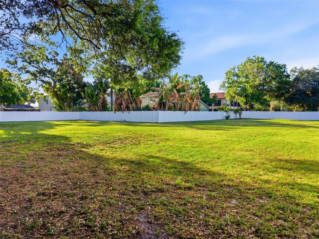 3348 West Hidden Haven Court Tampa, FL 33607 - Photo 15 of 43 a view of a swimming pool and trees in the background