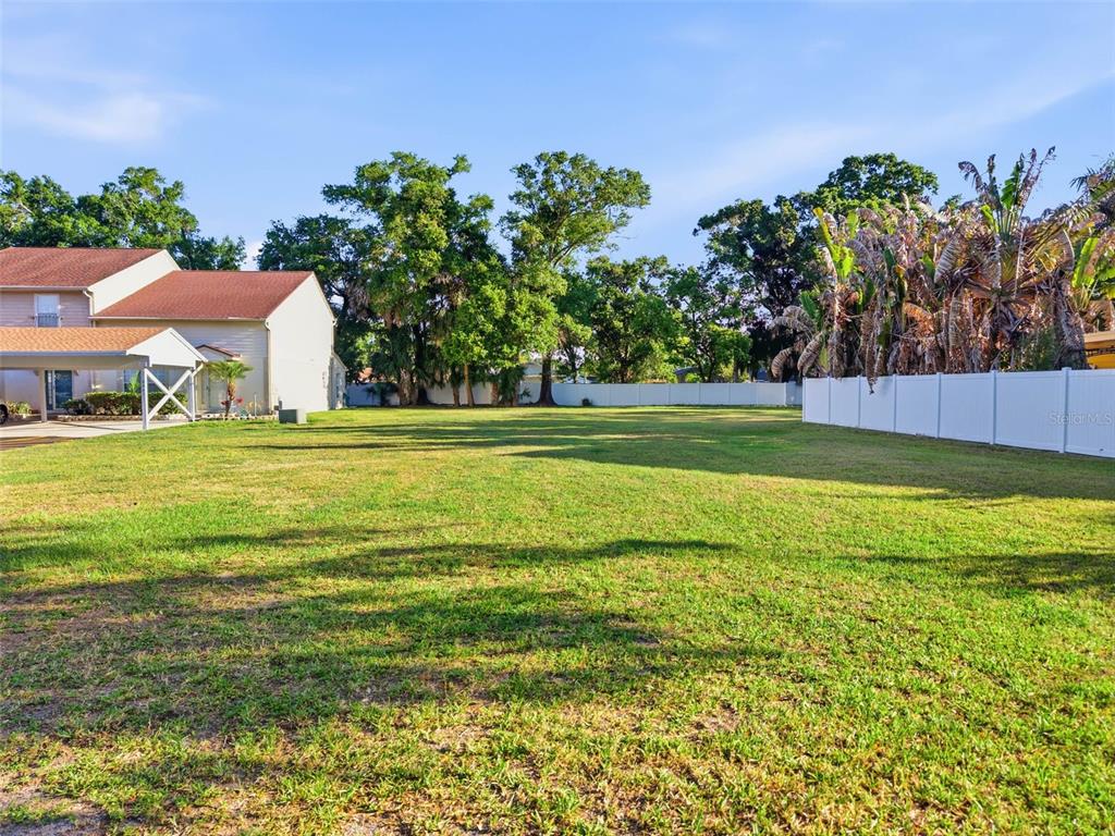 3348 West Hidden Haven Court Tampa, FL 33607 - Photo 20 of 43 a view of a swimming pool with an outdoor space and seating area
