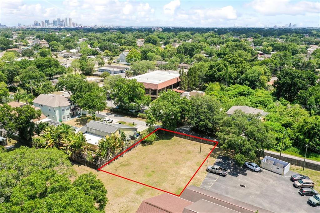 3348 West Hidden Haven Court Tampa, FL 33607 - Photo 6 of 43 an aerial view of a house with a yard and lake view