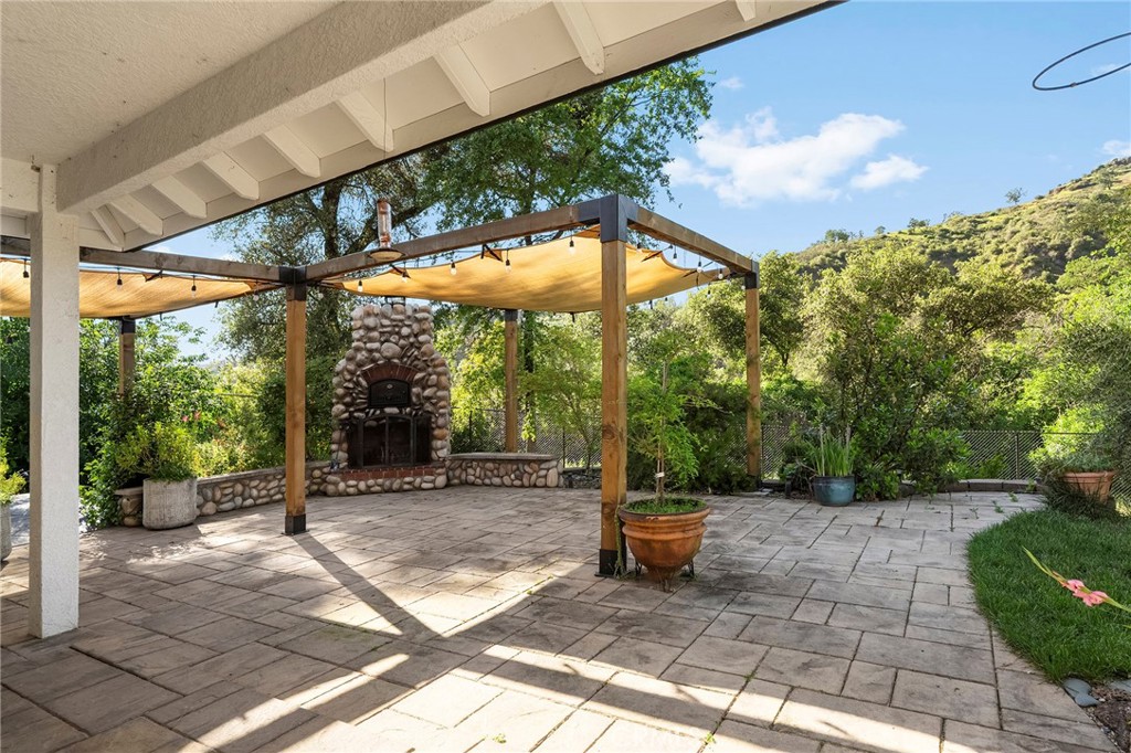 2262 Honey Run Road Chico, CA 95928 - Photo 54 of 74 a backyard of a house with fountain and outdoor seating