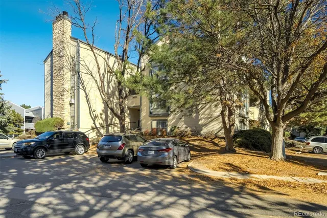 a group of cars parked in front of a house