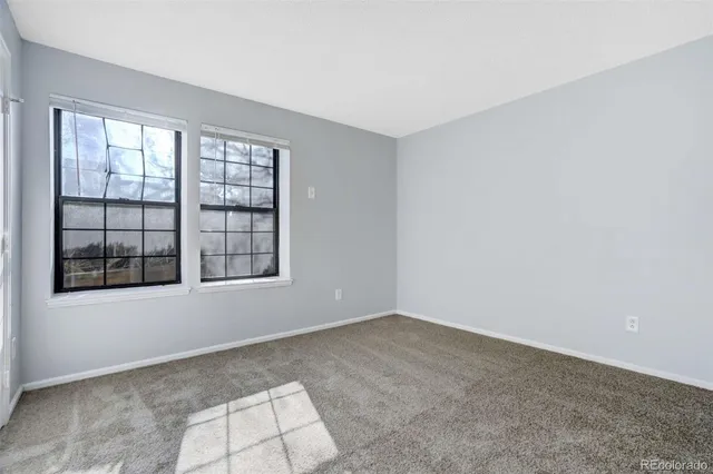 an empty room with windows