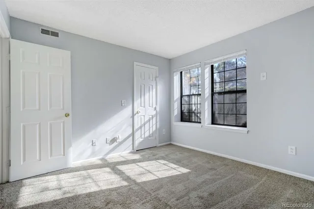 an empty room with windows