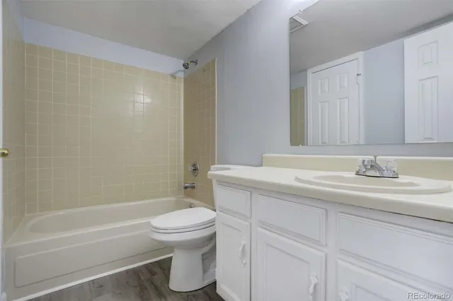 a bathroom with a sink a toilet and a bathtub