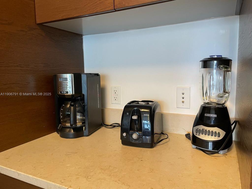 485 Brickell Avenue, Unit 3607 Miami, FL 33131 - Photo 15 of 36 a table and chairs in a room