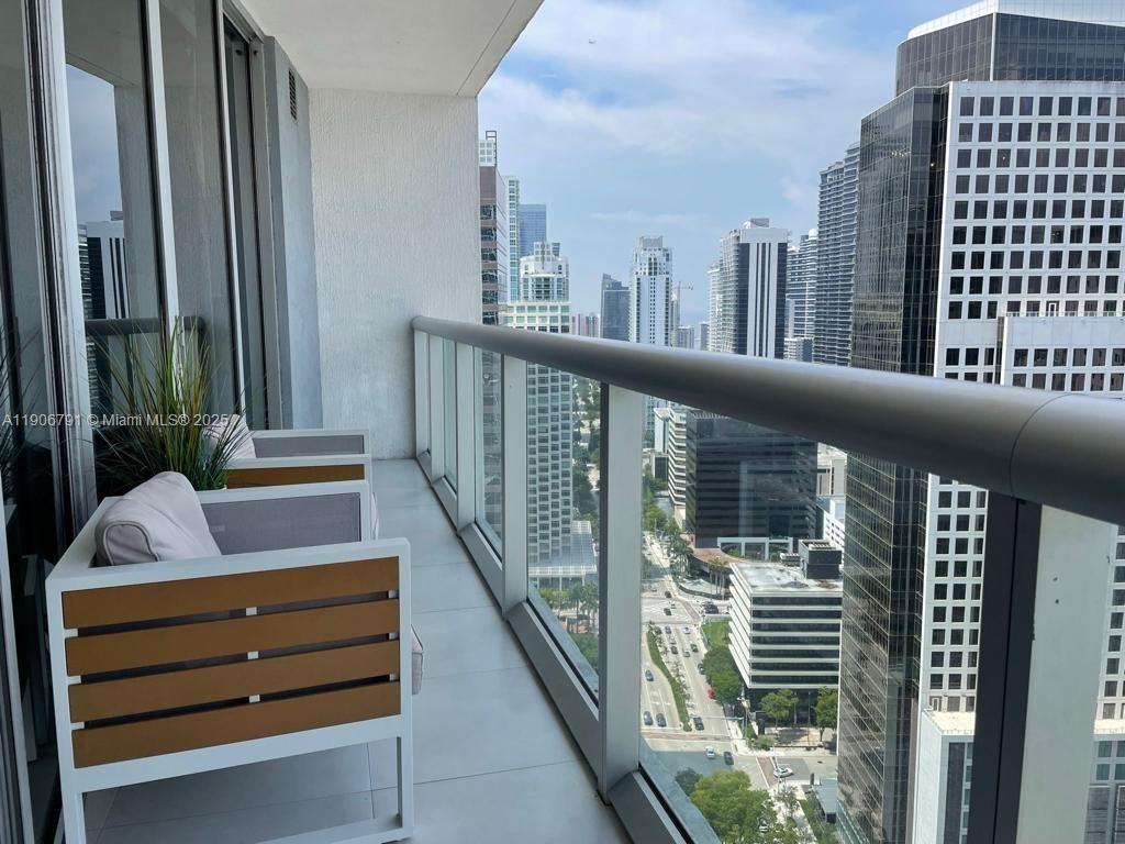 485 Brickell Avenue, Unit 3607 Miami, FL 33131 - Photo 16 of 36 a view of balcony with furniture