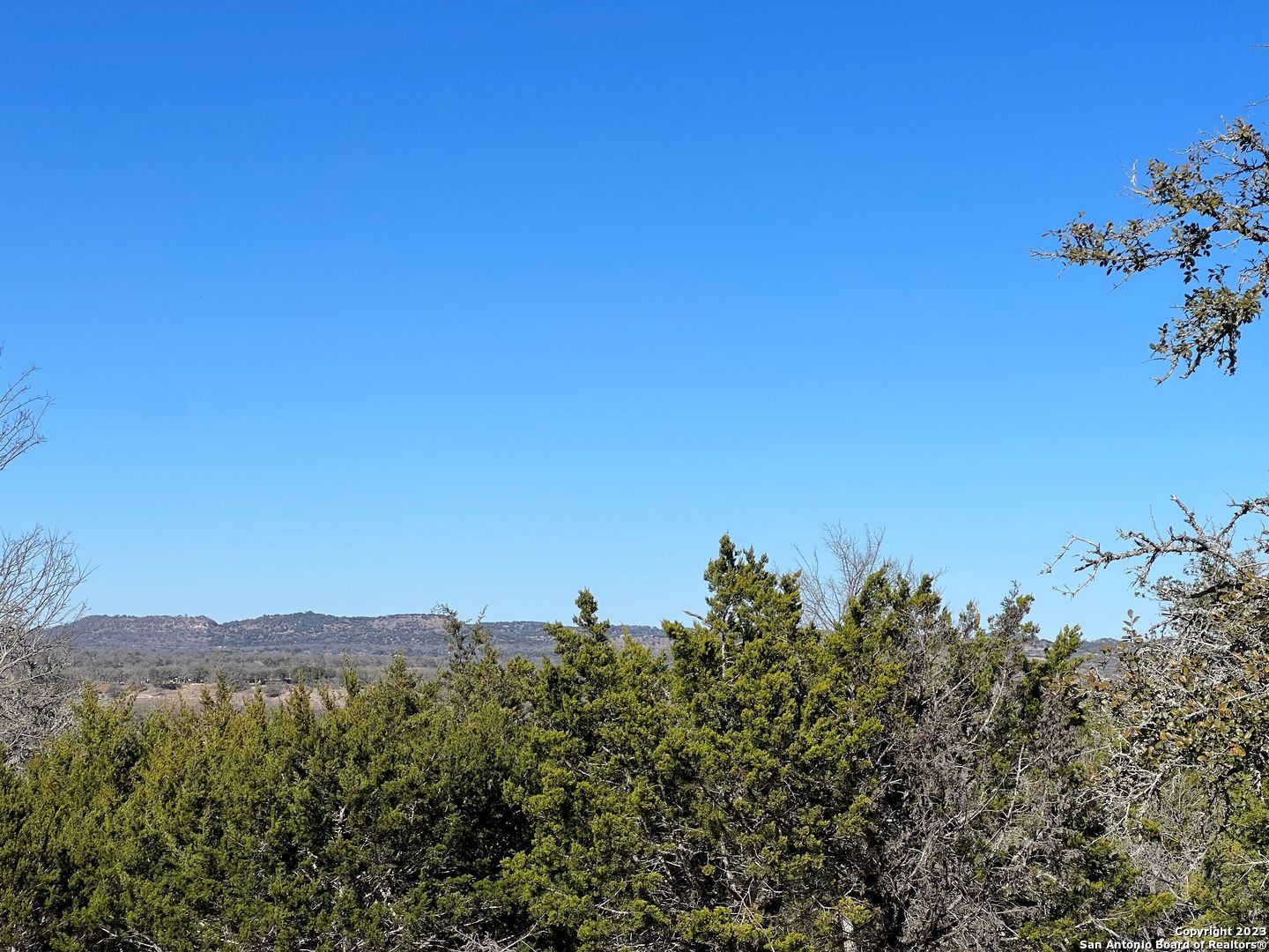 Tbd Waring Welfare Road Comfort, TX 78013 - Photo 12 of 17 a view of a lake with a mountain in the background
