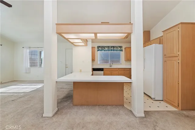 a view of kitchen with stainless steel appliances cabinets and a counter top space