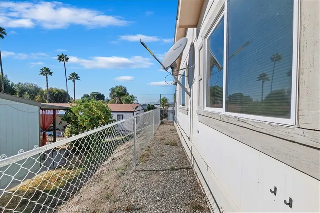 a view of a house with backyard and balcony