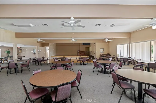 a outdoor space with furniture a window and a fireplace