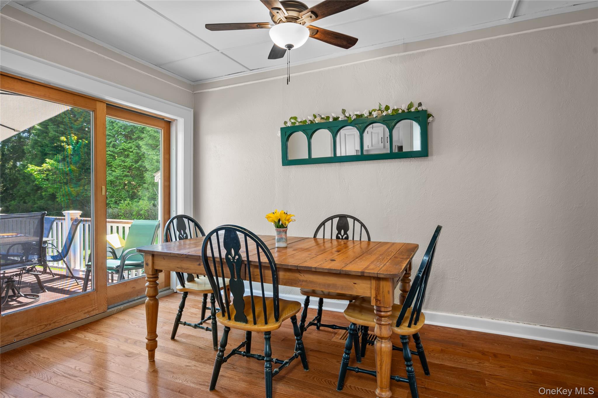 1 Pembroke Street New Rochelle, NY 10801 - Photo 17 of 47 Dining area with sliding glass doors to deck