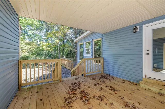 a view of dirt yard with a trees