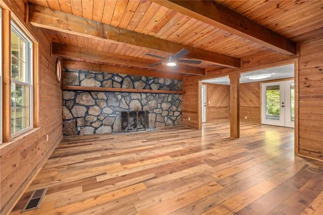 a view of a room with wooden walls