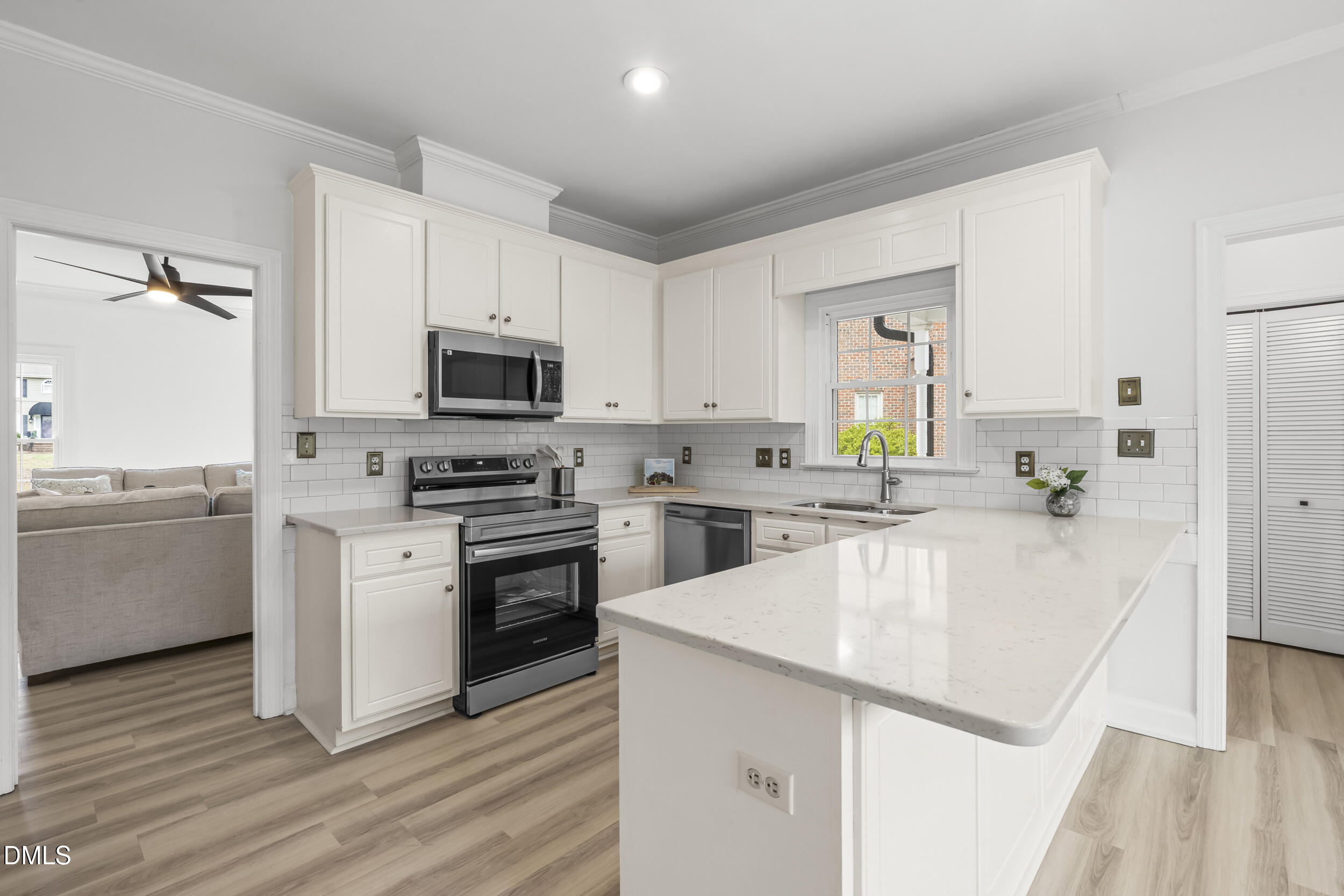 1213 Buxton Road Northwest Wilson, NC 27896 - Photo 11 of 36 a kitchen with a sink a stove and cabinets