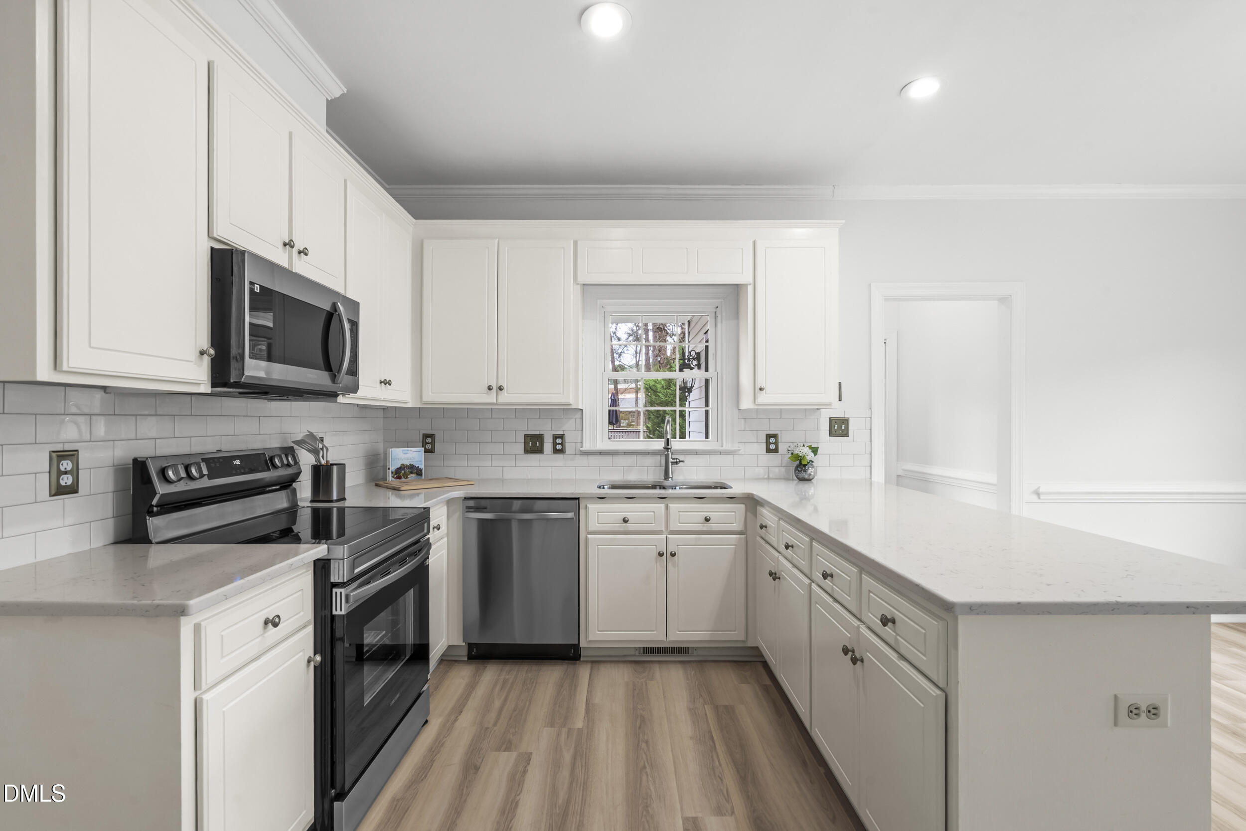 1213 Buxton Road Northwest Wilson, NC 27896 - Photo 10 of 36 a kitchen with a sink stove and cabinets