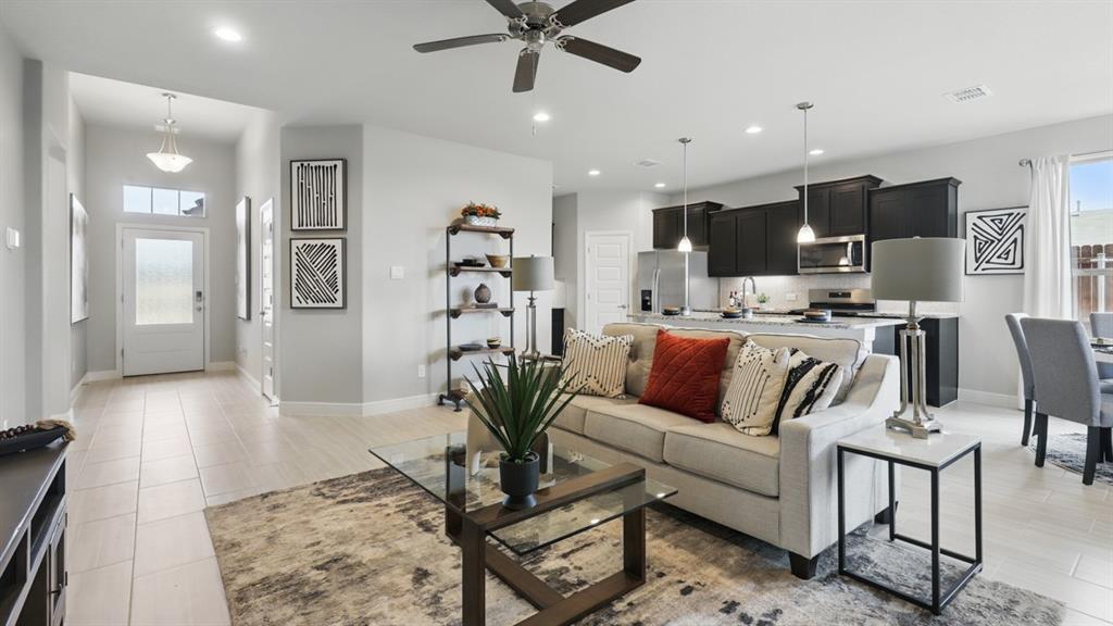1919 Cherokee Lane Cleburne, TX 76033 - Photo 12 of 34 a living room with furniture kitchen view and a wooden floor
