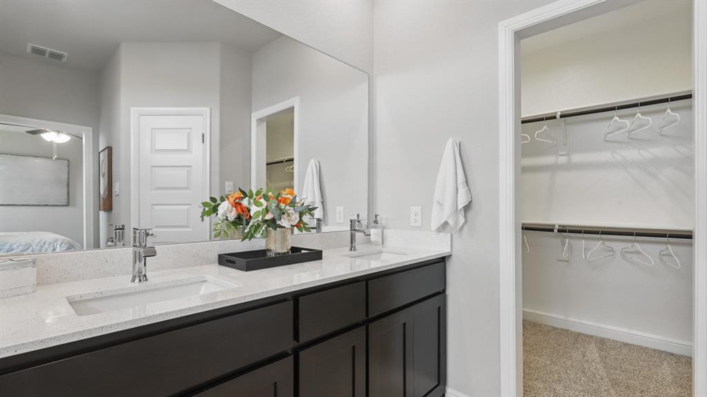 1919 Cherokee Lane Cleburne, TX 76033 - Photo 17 of 34 a bathroom with a double vanity sink mirror and double