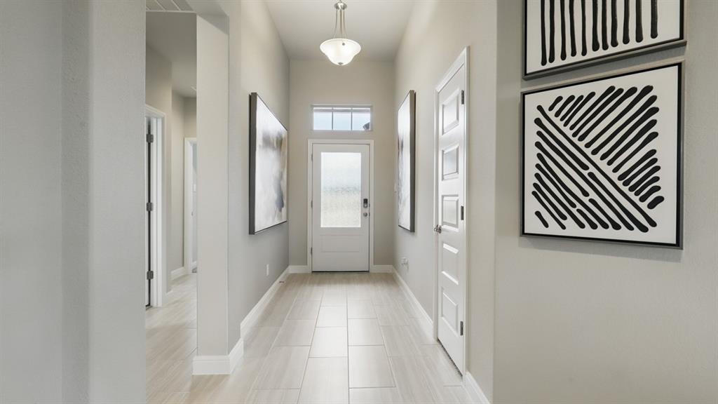 1919 Cherokee Lane Cleburne, TX 76033 - Photo 20 of 34 a view of a hallway with wooden floor