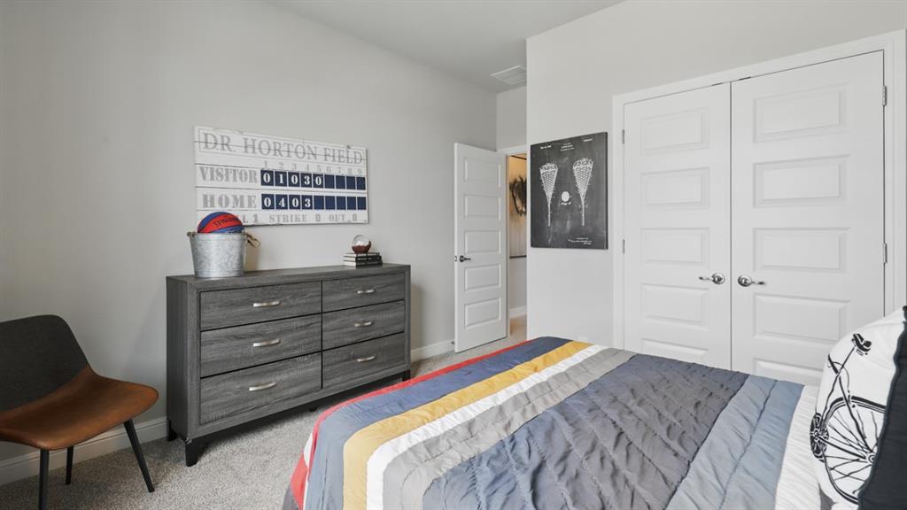1919 Cherokee Lane Cleburne, TX 76033 - Photo 22 of 34 a bedroom with a bed and a dresser