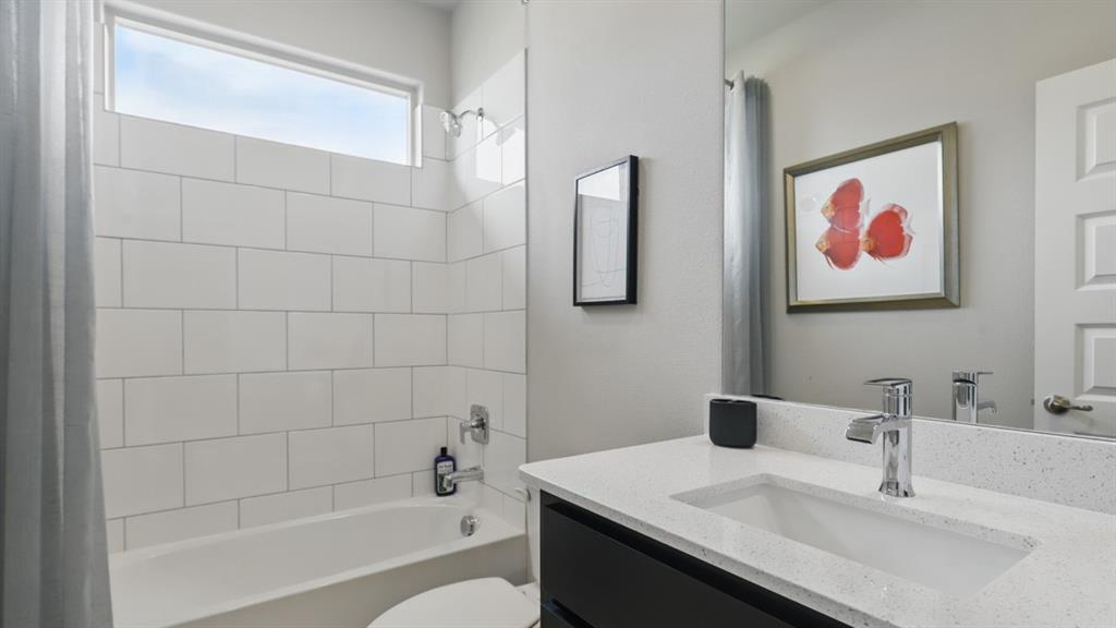 1919 Cherokee Lane Cleburne, TX 76033 - Photo 23 of 34 a bathroom with a sink and a bathtub