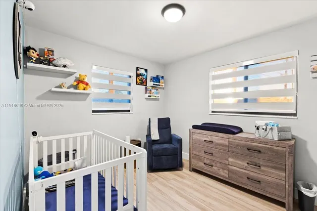 a bedroom with furniture and a window