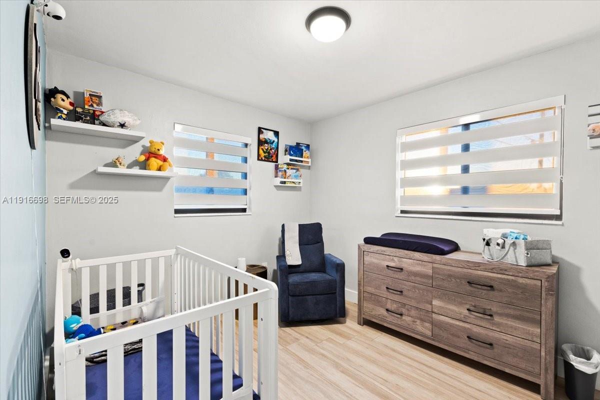 17121 Northwest 82nd Avenue Hialeah, FL 33015 - Photo 15 of 29 a bedroom with furniture and a window