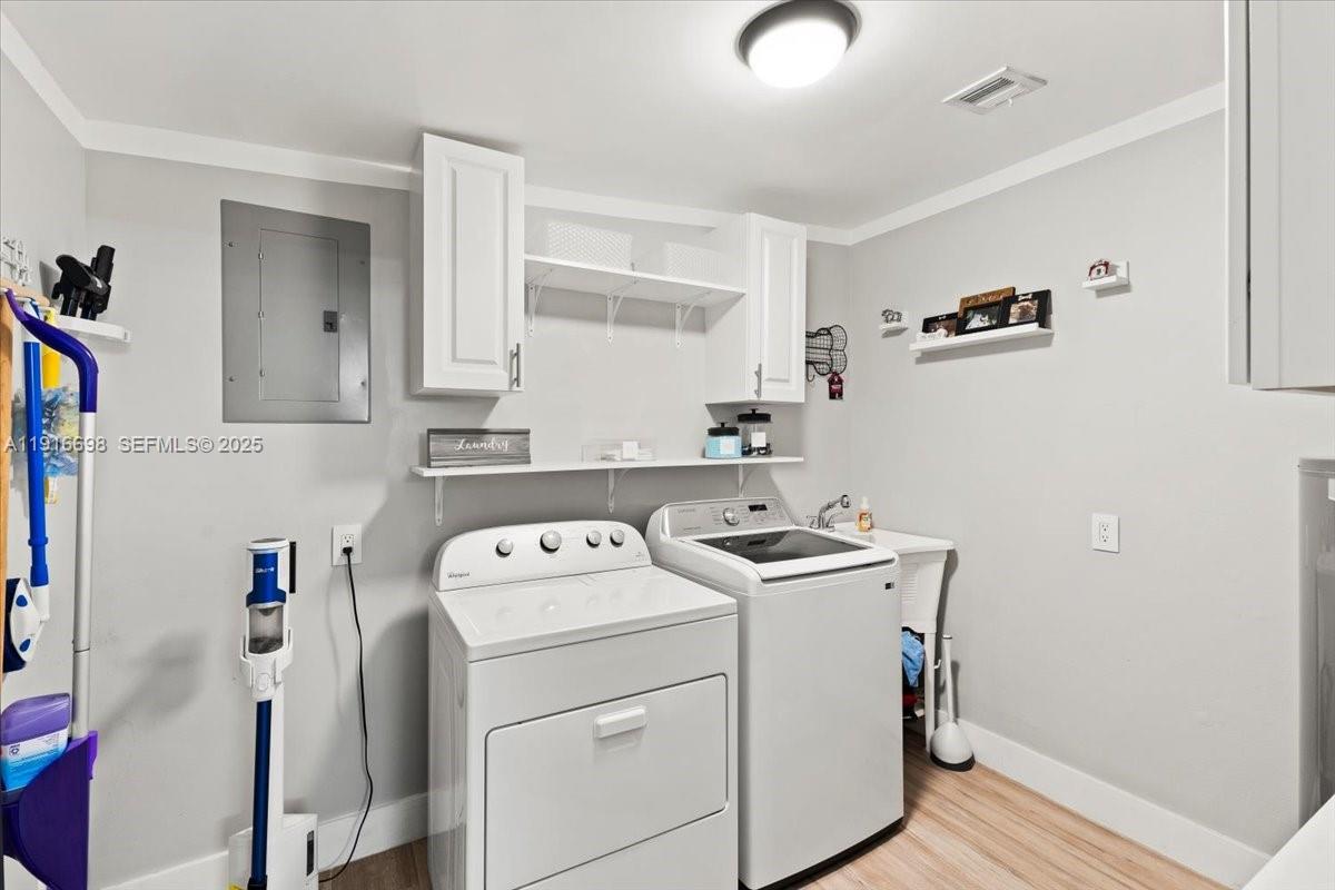 17121 Northwest 82nd Avenue Hialeah, FL 33015 - Photo 18 of 29 a utility room with dryer and washer