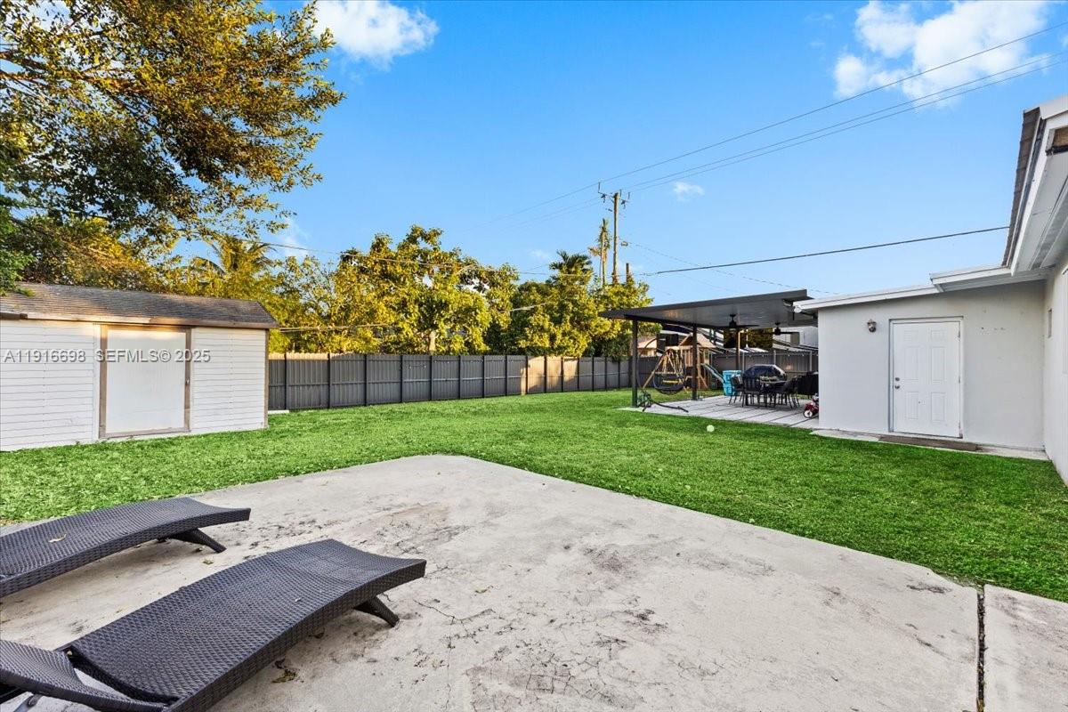 17121 Northwest 82nd Avenue Hialeah, FL 33015 - Photo 21 of 29 a view of a backyard with a garden and entertaining space