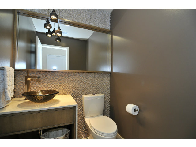 875 Riverside Drive Los Altos, CA 94024 - Photo 12 of 23 a bathroom with a toilet sink vanity and mirror