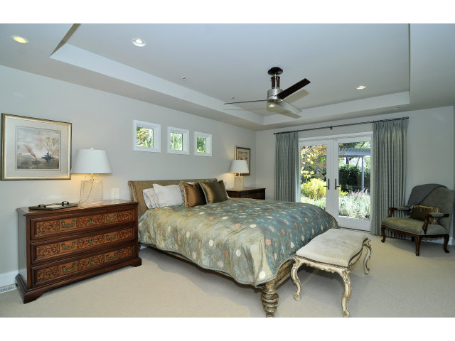 875 Riverside Drive Los Altos, CA 94024 - Photo 13 of 23 a bedroom with a bed and window