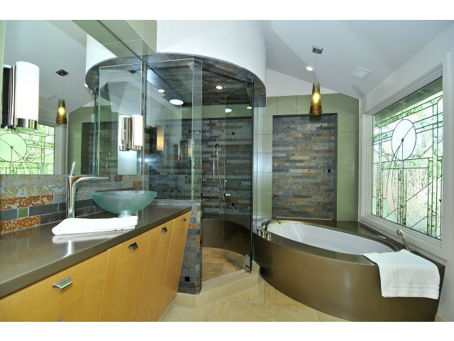 875 Riverside Drive Los Altos, CA 94024 - Photo 15 of 23 a bathroom with a granite countertop sink a large mirror and a bathtub