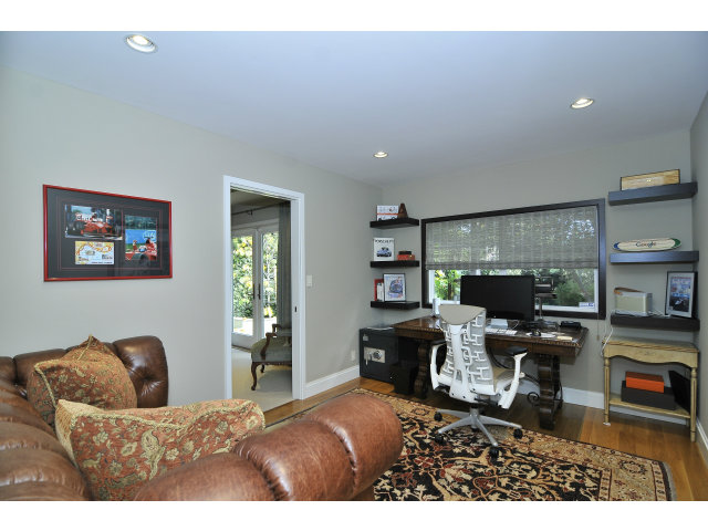 875 Riverside Drive Los Altos, CA 94024 - Photo 16 of 23 a living room with furniture a fireplace and a flat screen tv