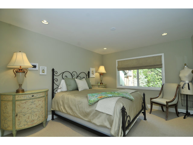 875 Riverside Drive Los Altos, CA 94024 - Photo 18 of 23 a bedroom with a bed and a chair