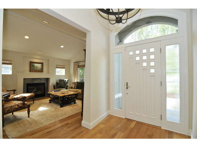 875 Riverside Drive Los Altos, CA 94024 - Photo 2 of 23 a living room with furniture a fireplace and a large mirror