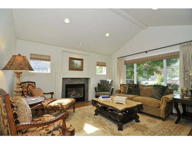 875 Riverside Drive Los Altos, CA 94024 - Photo 3 of 23 a living room with furniture a large window and a fireplace