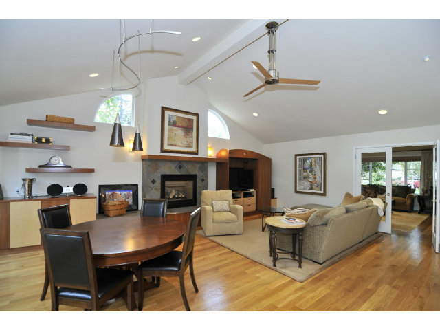 875 Riverside Drive Los Altos, CA 94024 - Photo 5 of 23 a living room with furniture a fireplace and a chandelier
