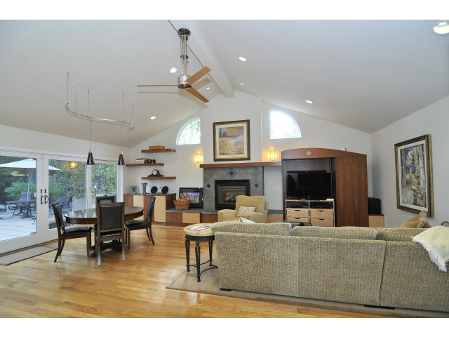 875 Riverside Drive Los Altos, CA 94024 - Photo 7 of 23 a living room with fireplace furniture and a flat screen tv