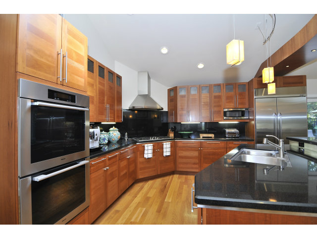 875 Riverside Drive Los Altos, CA 94024 - Photo 10 of 23 a kitchen with stainless steel appliances granite countertop a sink a stove microwave and cabinets
